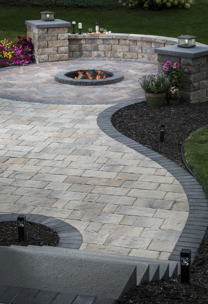 Mid-sized traditional backyard partial sun formal garden in New York with a fire feature and natural stone pavers for summer.