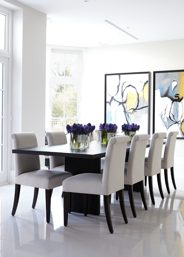 Inspiration for a contemporary dining room in London with white walls.