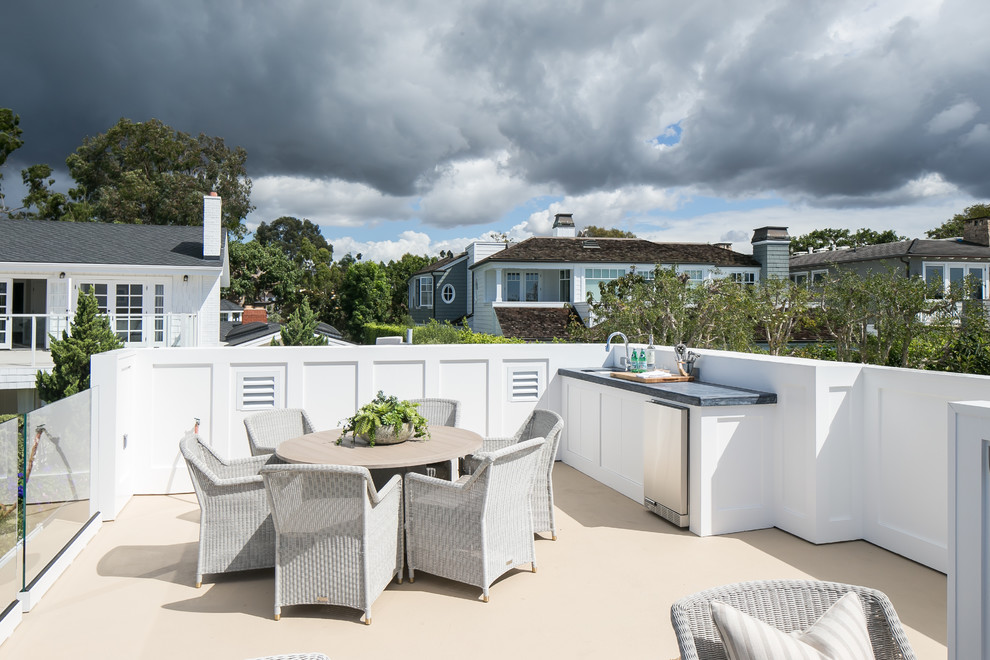 Beach style rooftop and rooftop deck in Los Angeles with an outdoor kitchen and no cover.