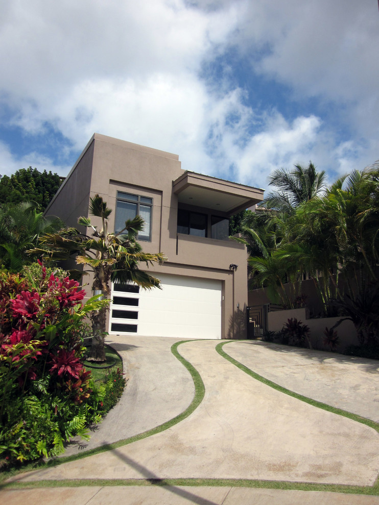 Tropical two-storey brown exterior in Hawaii.