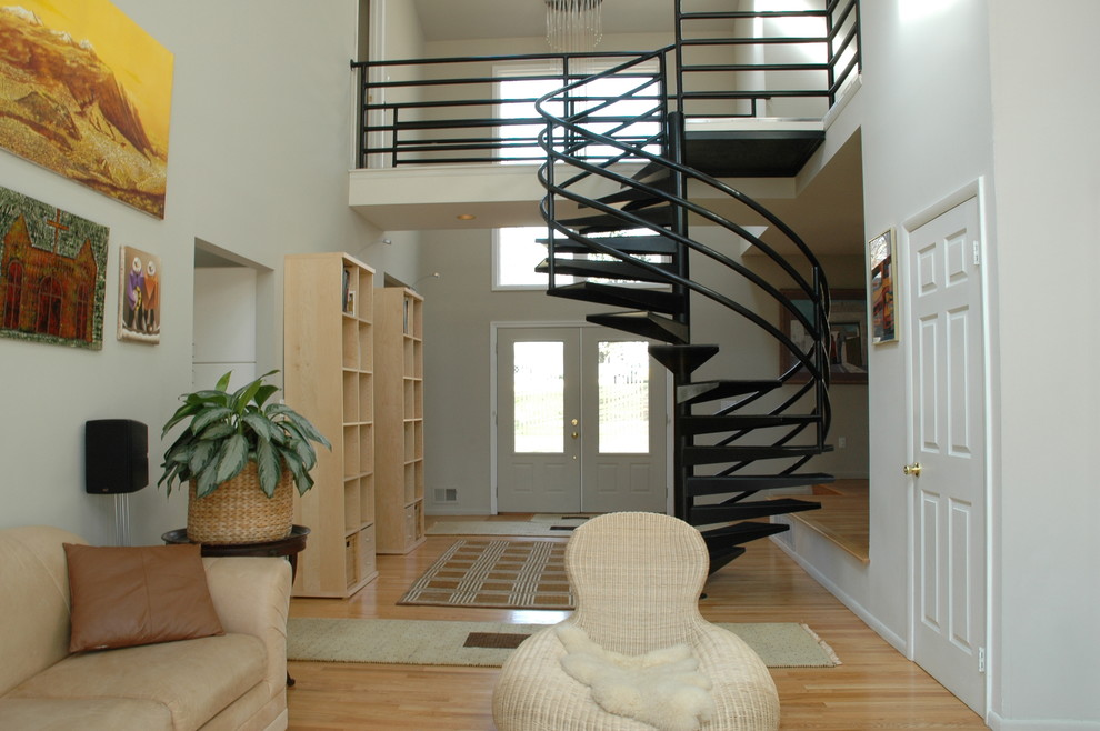Photo of a mid-sized contemporary metal spiral staircase in Miami with open risers.