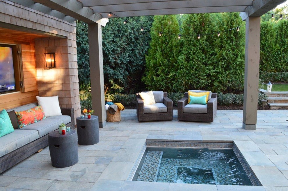 Traditional patio in Other with natural stone pavers.