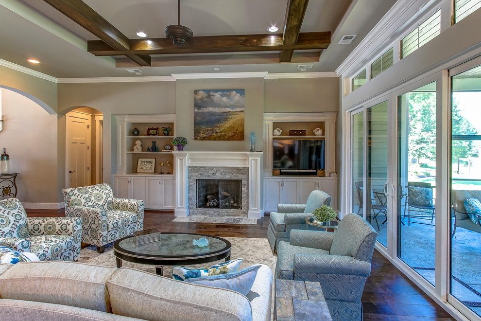 This is an example of a mid-sized traditional formal open concept living room in Atlanta with a stone fireplace surround, brown walls, dark hardwood floors, a standard fireplace, no tv and brown floor.