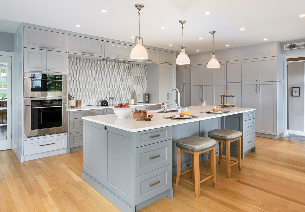 Transitional eat-in kitchen photo in Boston with gray cabinets, quartz countertops, multicolored backsplash, marble backsplash, stainless steel appliances, an island and white countertops