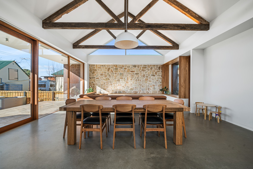 This is an example of a midcentury dining room in Hobart.