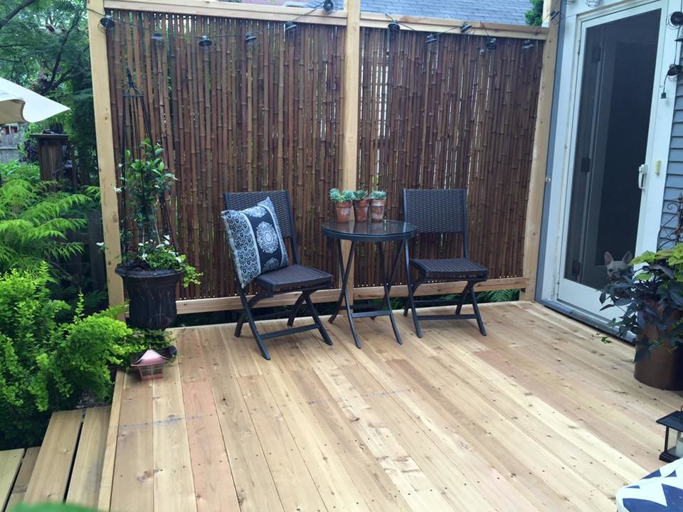Design ideas for a mid-sized asian backyard deck in Minneapolis with no cover.
