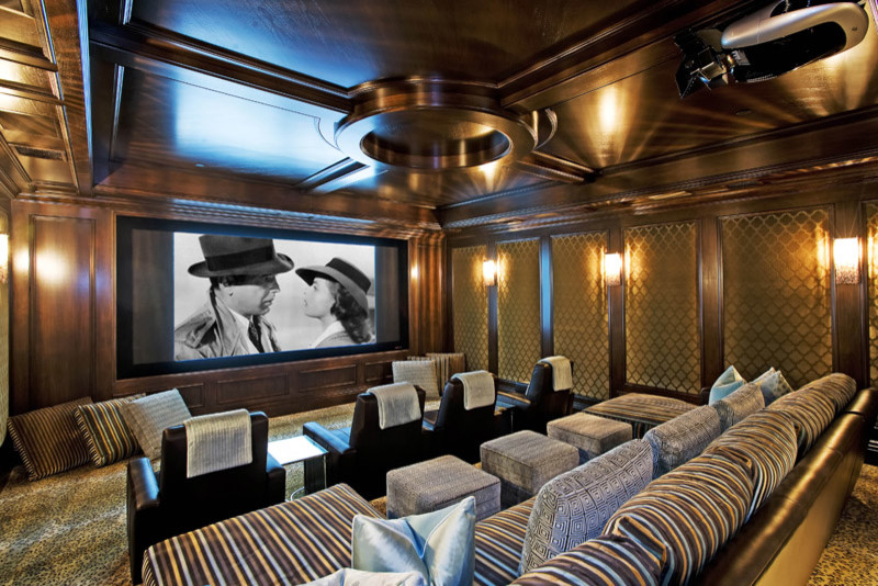 Design ideas for a large traditional enclosed home theatre in Los Angeles with brown walls, carpet, a projector screen and multi-coloured floor.