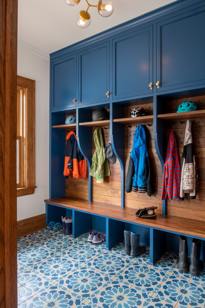 Mudroom - mid-sized transitional ceramic tile and blue floor mudroom idea in Minneapolis with beige walls