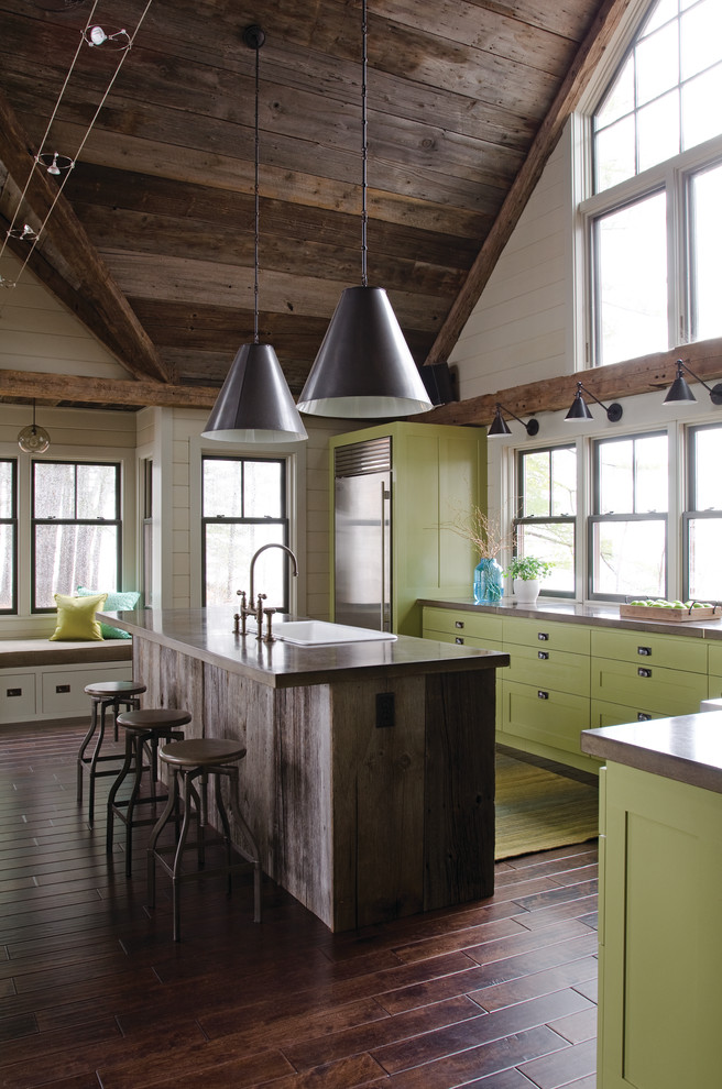 Inspiration for a large contemporary l-shaped eat-in kitchen in Boston with stainless steel appliances, green cabinets, a single-bowl sink, recessed-panel cabinets, solid surface benchtops, dark hardwood floors and with island.