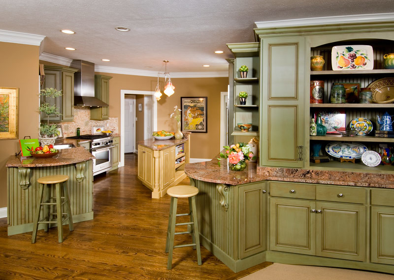 Transitional medium tone wood floor eat-in kitchen photo in Indianapolis with green cabinets, granite countertops, multicolored backsplash, stainless steel appliances and an island