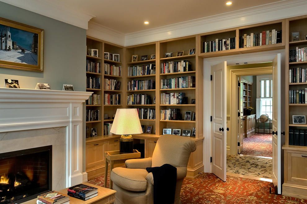 This is an example of a traditional home office in New York with grey walls and carpet.