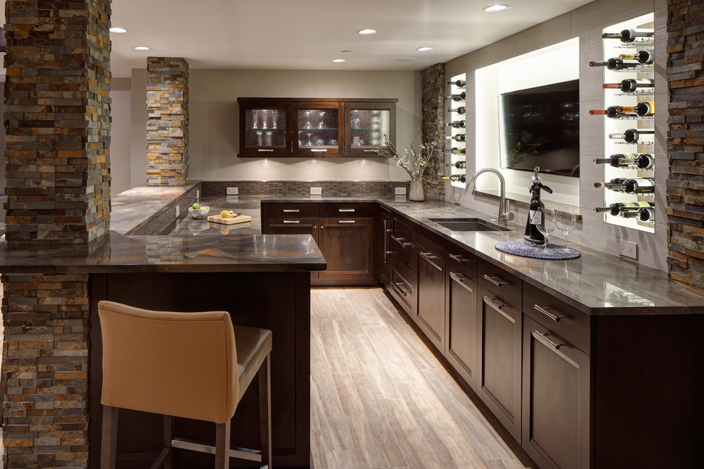 Design ideas for a mid-sized transitional u-shaped wet bar in Chicago with shaker cabinets, dark wood cabinets, marble benchtops, white splashback, stone tile splashback, an undermount sink and ceramic floors.