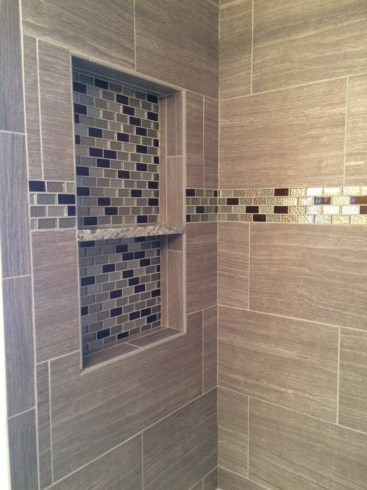Mid-sized master bathroom in Chicago with an alcove tub, a shower/bathtub combo and gray tile.