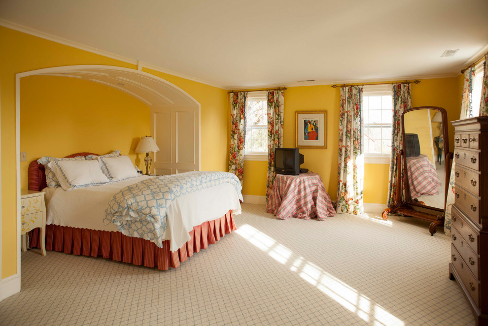 Design ideas for a traditional bedroom in New York with yellow walls, carpet and white floor.