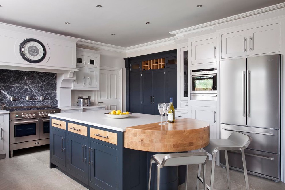 Design ideas for a large transitional u-shaped eat-in kitchen in Belfast with an undermount sink, beaded inset cabinets, quartzite benchtops, grey splashback, stone slab splashback, stainless steel appliances, ceramic floors, with island and white cabinets.