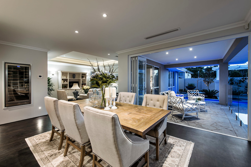 This is an example of a transitional open plan dining in Perth with grey walls, dark hardwood floors and no fireplace.