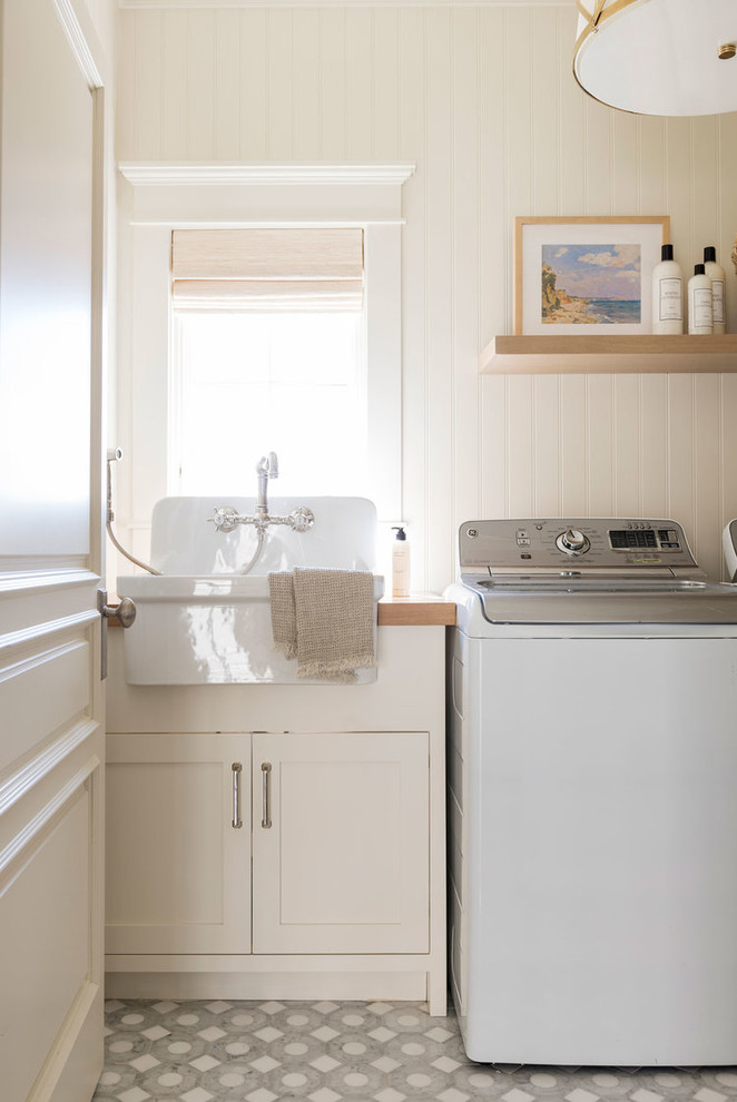 Design ideas for a small beach style galley dedicated laundry room in Salt Lake City with ceramic floors and multi-coloured floor.