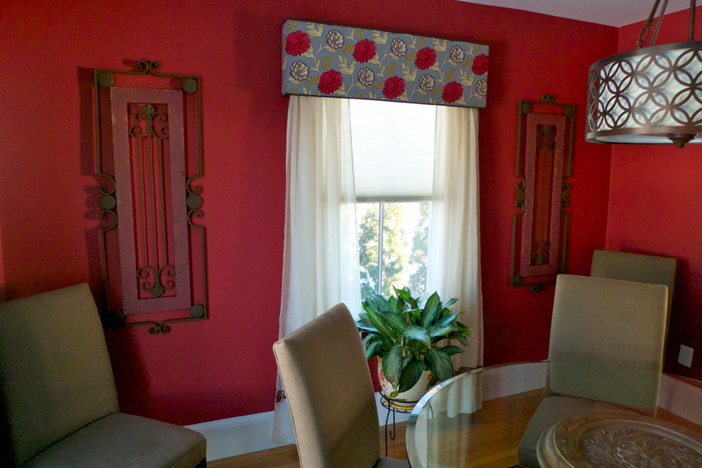 This is an example of an eclectic dining room in Providence.