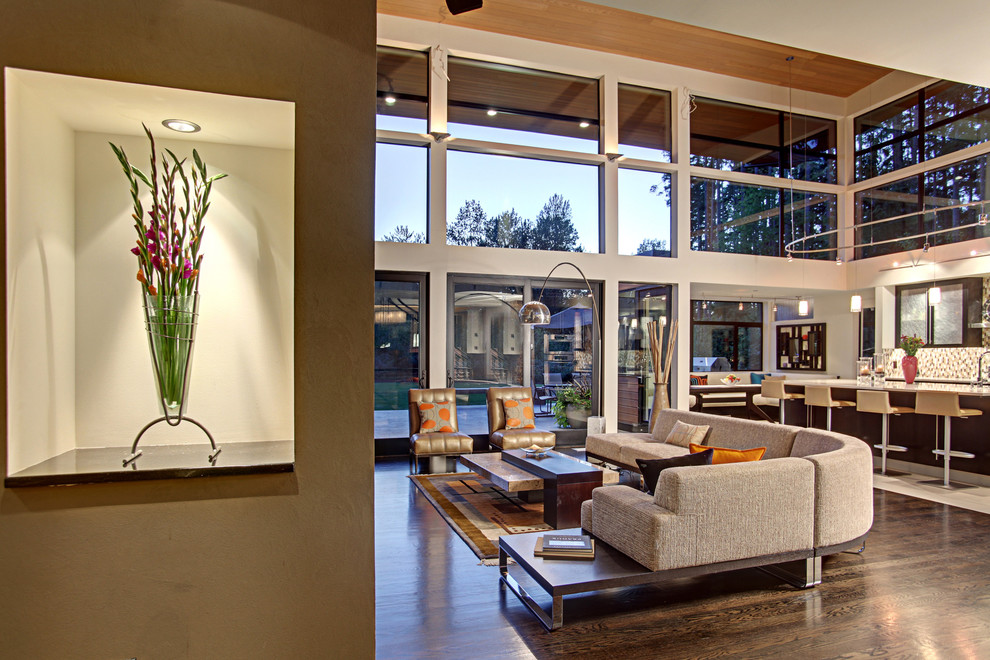 Photo of a contemporary open concept living room in Seattle with white walls.