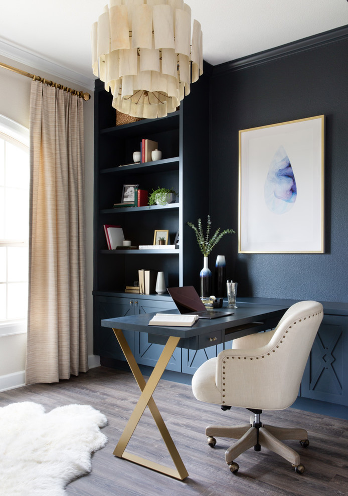 Inspiration for a mid-sized transitional craft room in Austin with multi-coloured walls, dark hardwood floors, no fireplace, a freestanding desk and grey floor.