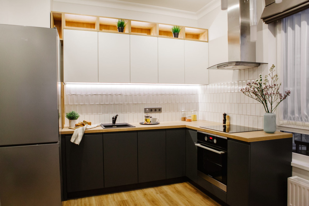Large trendy l-shaped eat-in kitchen photo in Saint Petersburg with an undermount sink, yellow cabinets and an island