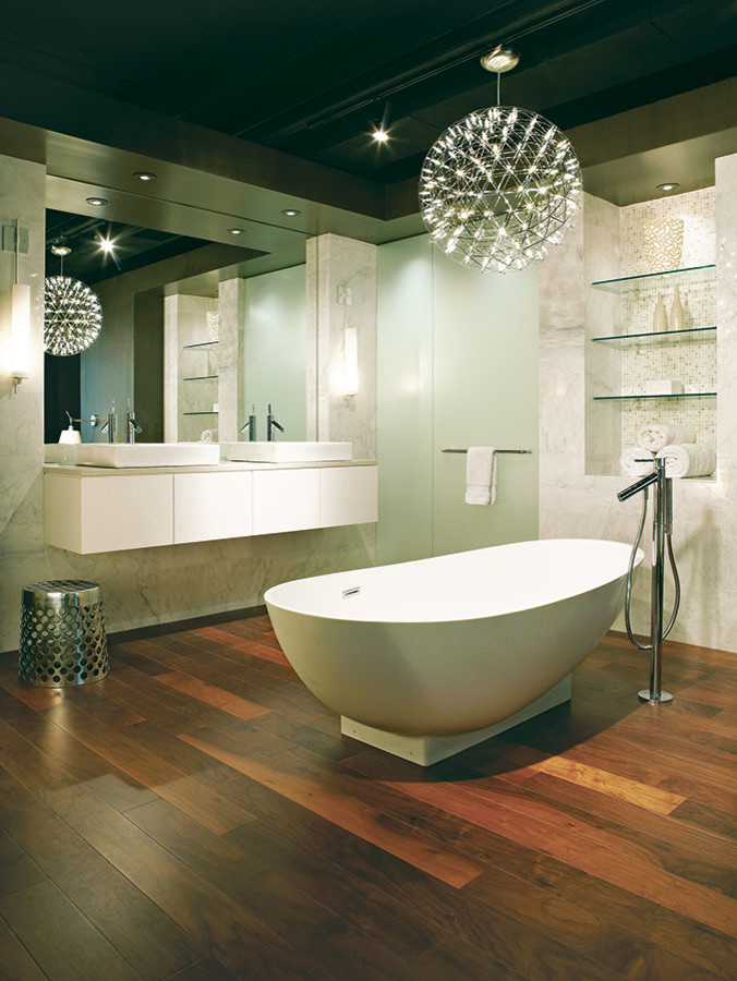 Photo of a mid-sized contemporary master bathroom in Chicago with a drop-in sink, flat-panel cabinets, white cabinets, quartzite benchtops, a freestanding tub, multi-coloured walls and medium hardwood floors.