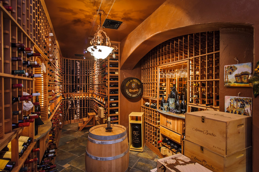 Inspiration for a mediterranean wine cellar in San Francisco with storage racks.