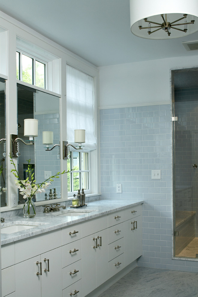 Contemporary bathroom in Boston with marble benchtops, subway tile and an undermount sink.
