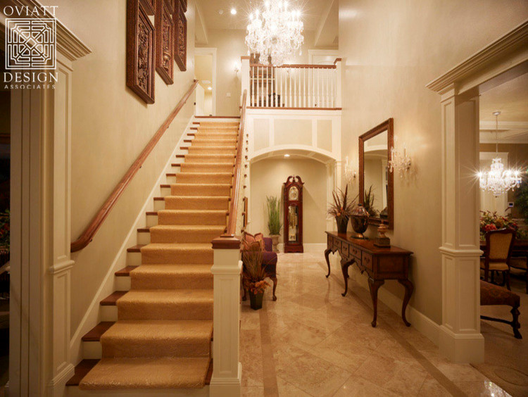 Inspiration for a large traditional foyer in Salt Lake City with a single front door, beige walls, a dark wood front door and granite floors.