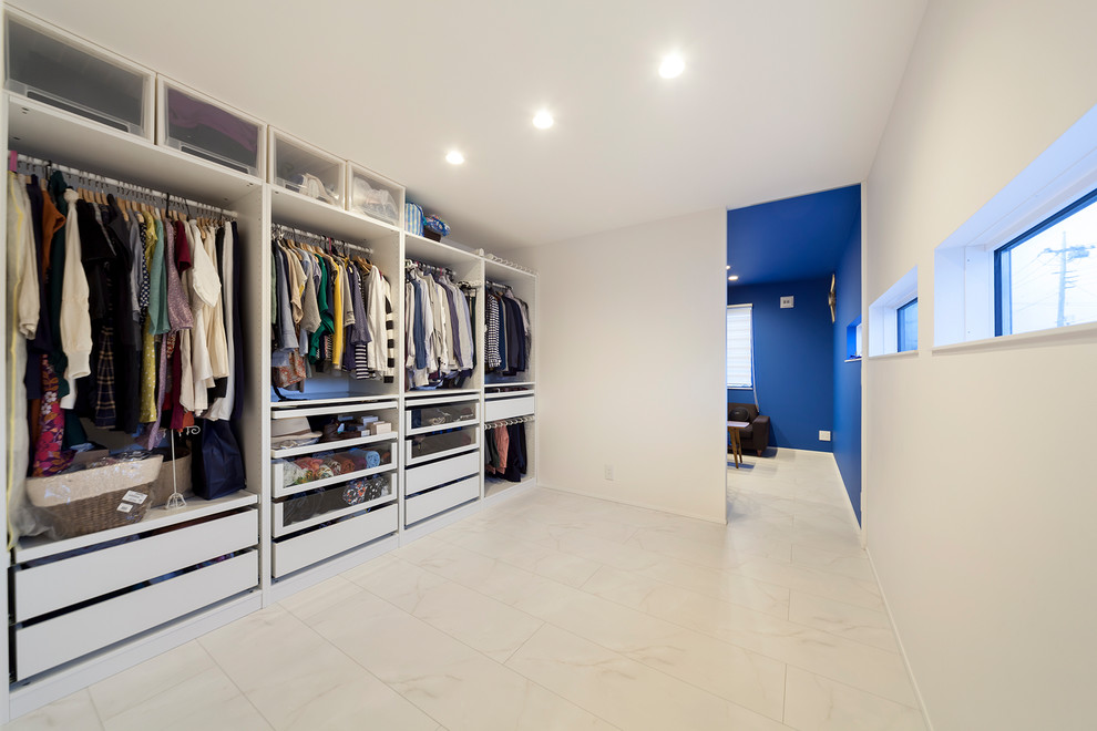 Inspiration for a modern storage and wardrobe in Other with white floor.