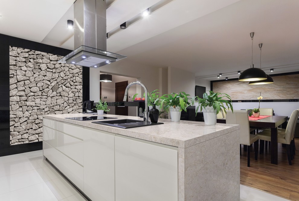 Mid-sized transitional galley eat-in kitchen in Portland with an undermount sink, flat-panel cabinets, beige cabinets, solid surface benchtops, porcelain floors, with island and white floor.