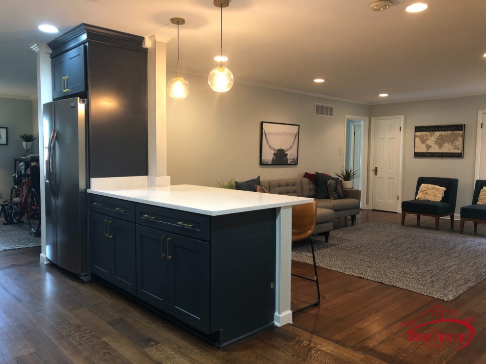 Inspiration for a mid-sized transitional galley medium tone wood floor open concept kitchen remodel with an undermount sink, shaker cabinets, blue cabinets, quartzite countertops, white backsplash, ceramic backsplash, stainless steel appliances, a peninsula and white countertops