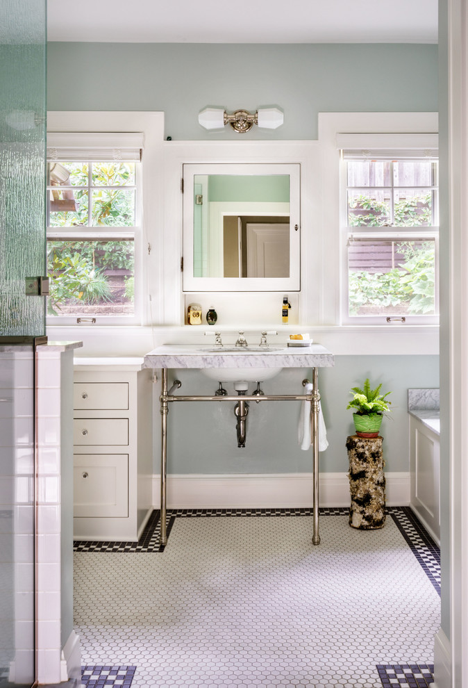 Photo of a traditional master bathroom in Portland with recessed-panel cabinets, white cabinets, grey walls, mosaic tile floors, an undermount sink and white floor.