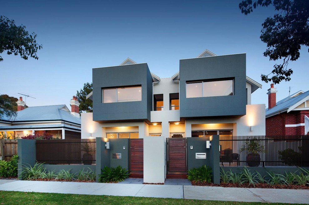 Mid-sized contemporary two-storey stucco grey duplex exterior in Perth with a gable roof.