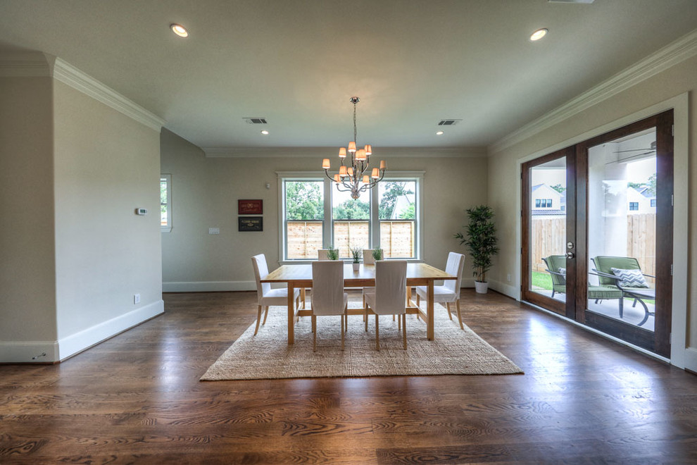 Mid-sized transitional medium tone wood floor and brown floor great room photo in Houston with beige walls and no fireplace