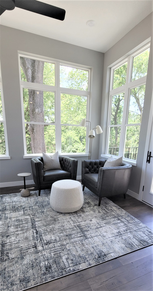 Example of a transitional sunroom design in Cedar Rapids