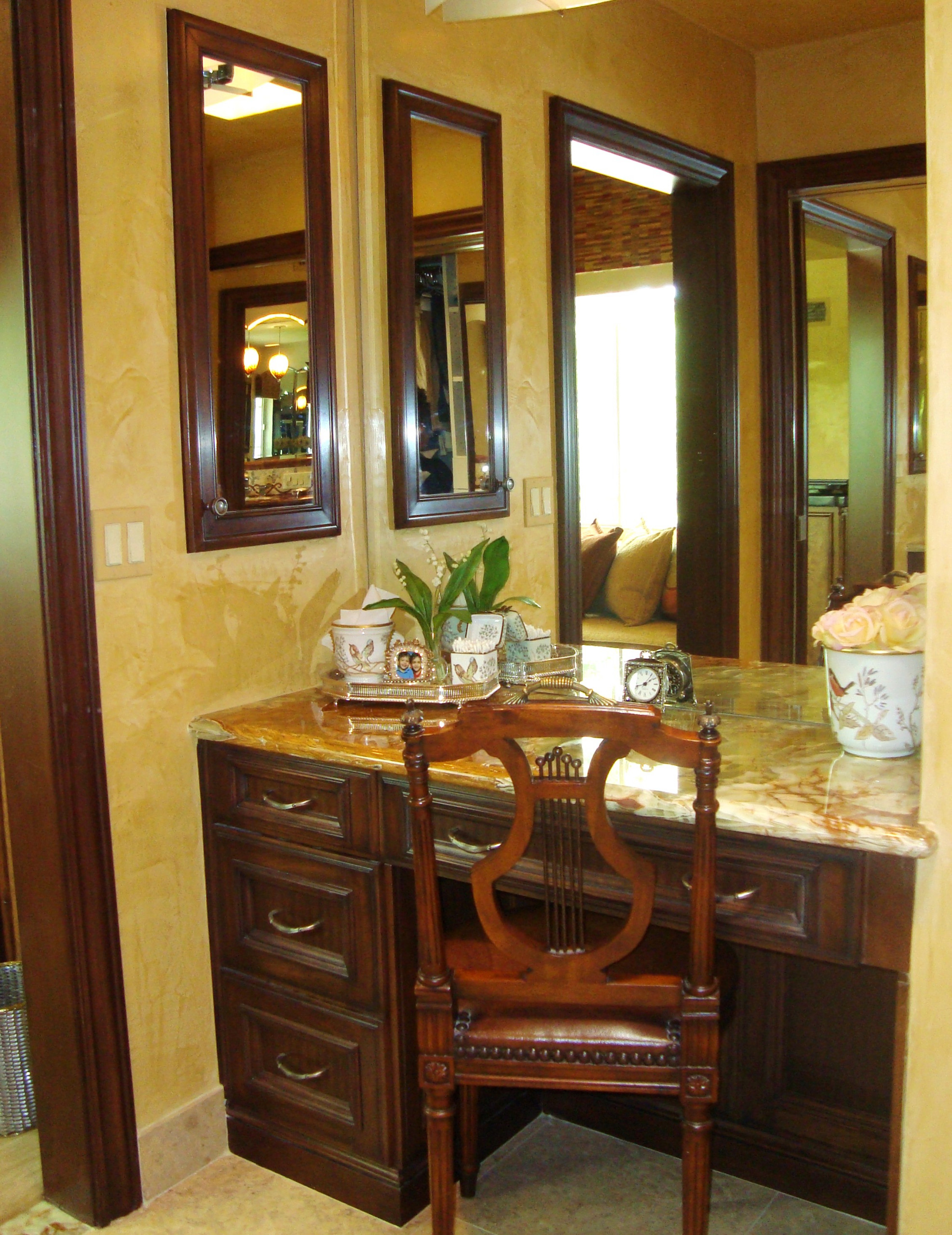 The Rubin-Onyx counter top in "her" dressing area with Woodmode cabinetry