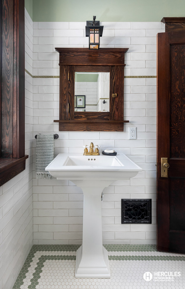 Photo of a small traditional shower room bathroom in St Louis with white tiles, ceramic tiles, green walls, porcelain flooring, a pedestal sink, white floors and a single sink.