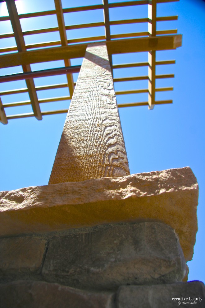 Example of a mid-sized mountain style backyard deck design in Denver with a pergola