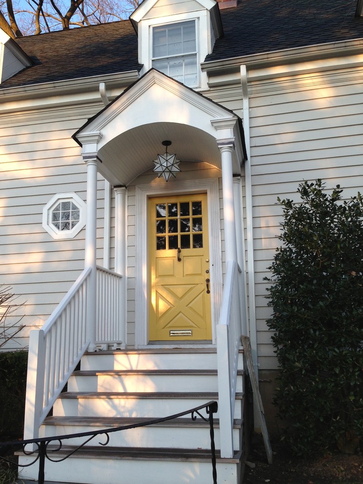 Mid-sized traditional front door in New York with beige walls, a single front door and a yellow front door.