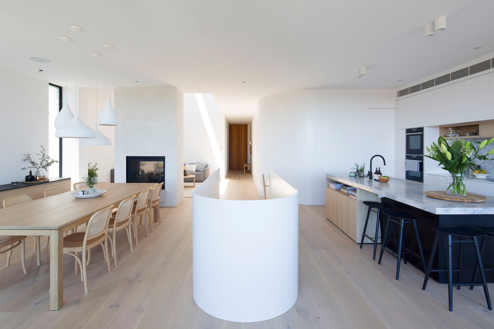Inspiration for a large contemporary galley open plan kitchen in Sydney with with island.