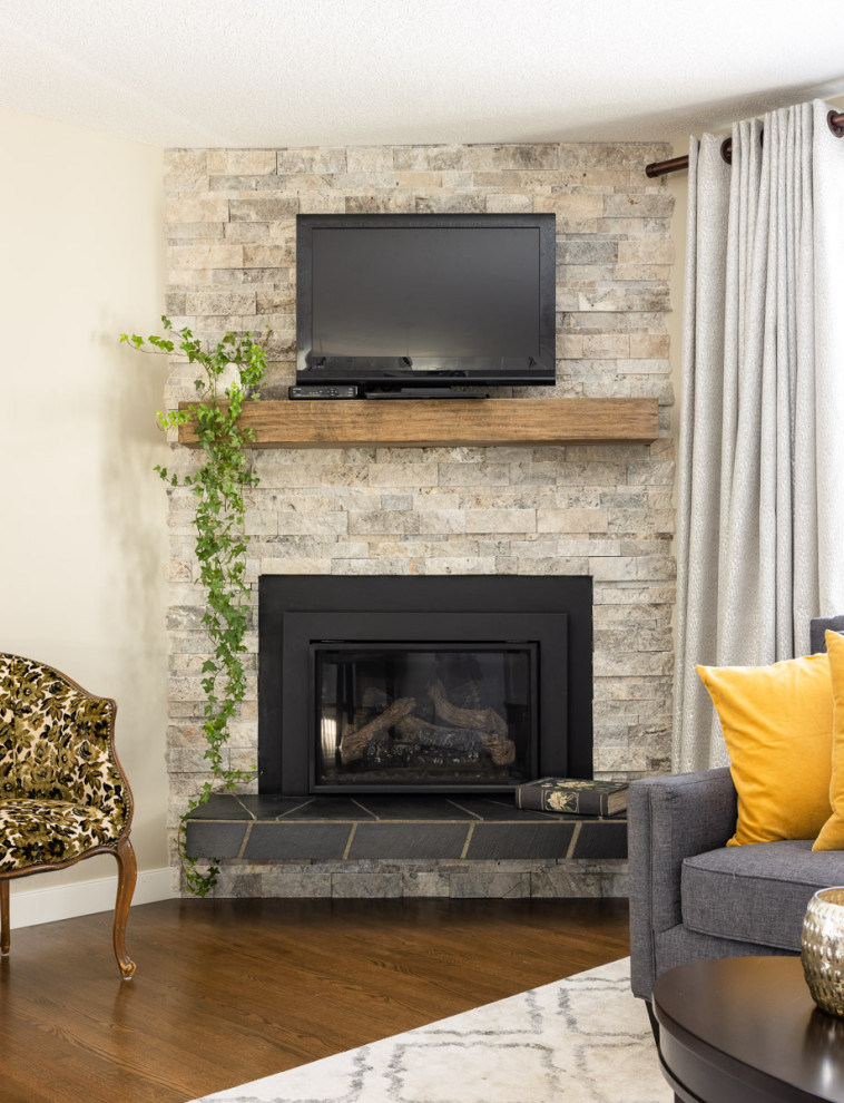 Example of a transitional home design design in Calgary