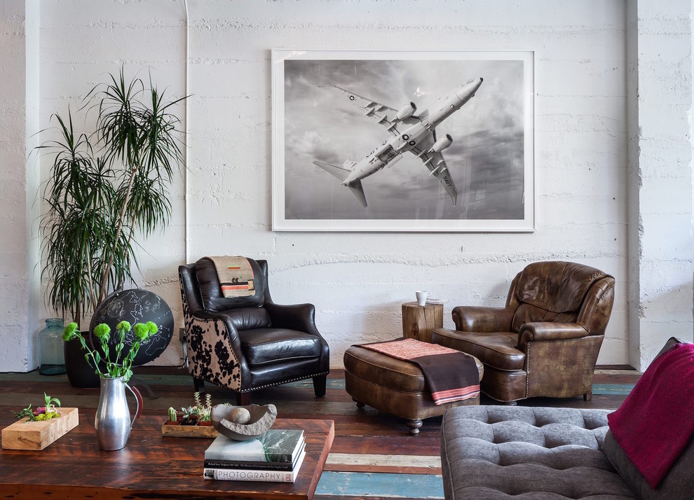 Example of an urban painted wood floor living room design in Portland with white walls