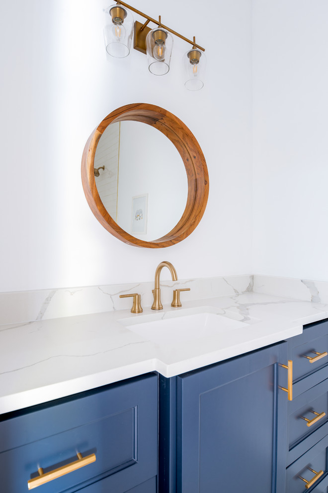 Inspiration for a contemporary kids bathroom in Dallas with shaker cabinets, blue cabinets, a drop-in tub, a shower/bathtub combo, white tile, subway tile, white walls, mosaic tile floors, an undermount sink, engineered quartz benchtops, white floor, an open shower and white benchtops.