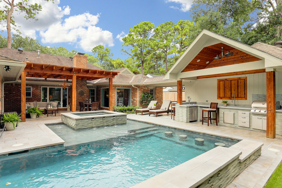 This is an example of an arts and crafts backyard l-shaped pool in Houston.