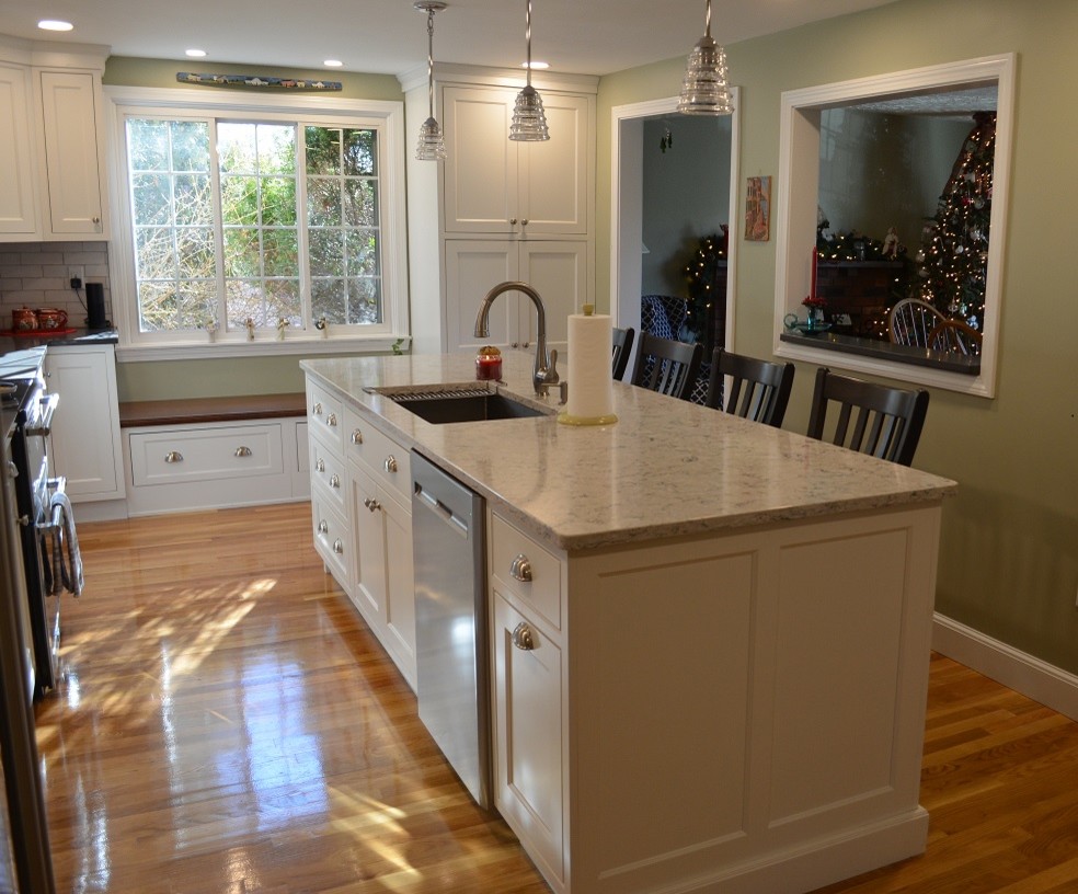 Eat-in kitchen - transitional l-shaped light wood floor eat-in kitchen idea in Boston with an undermount sink, beaded inset cabinets, white cabinets, quartz countertops, white backsplash, ceramic backsplash, stainless steel appliances, an island and gray countertops