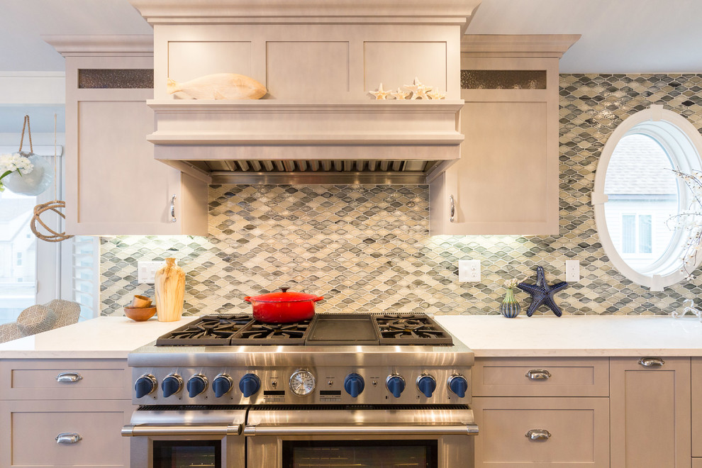 Inspiration for a mid-sized coastal l-shaped medium tone wood floor and beige floor open concept kitchen remodel in Boston with shaker cabinets, gray cabinets, granite countertops, multicolored backsplash, stainless steel appliances and an island
