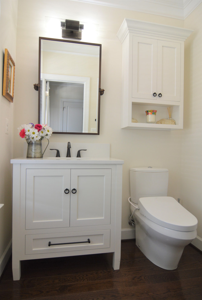 Mid-sized transitional single-sink bathroom photo in DC Metro with recessed-panel cabinets, white cabinets, quartz countertops and white countertops