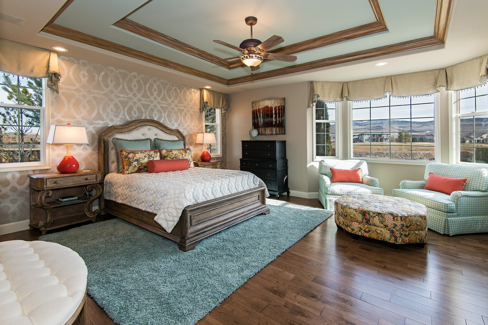 Large traditional master bedroom in Other with beige walls, medium hardwood floors and no fireplace.