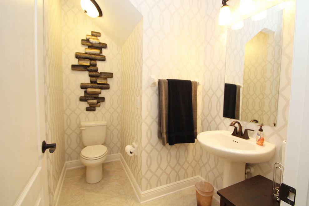 Design ideas for a contemporary powder room in Tampa with a pedestal sink.